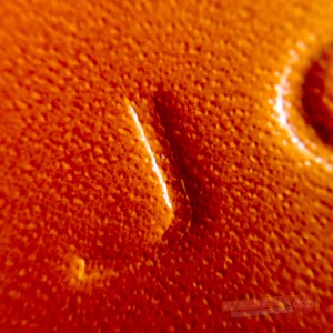Closeup of the beautiful, supple leather cover on the Gallery Leather Oporto Journal. This close up, it looks like an orange, doesn't it?