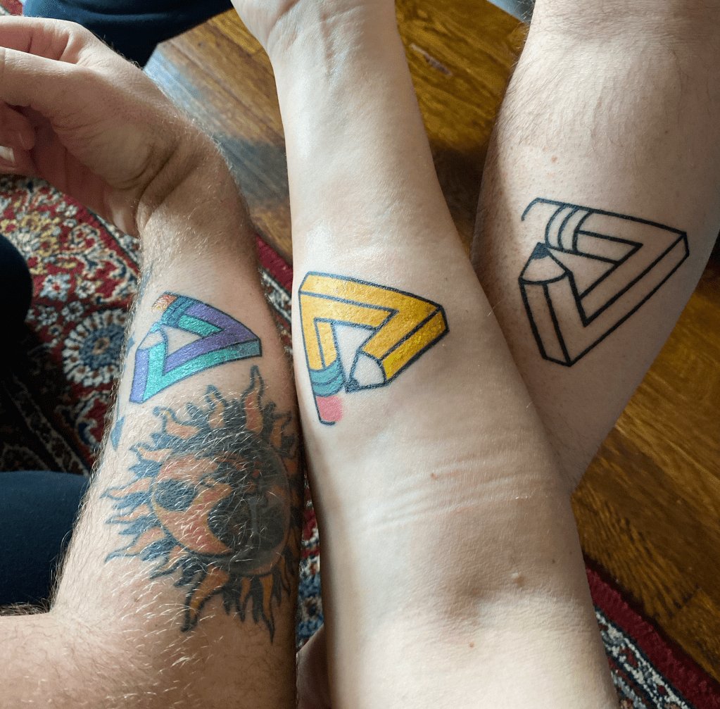 Three arms, each with a different version of the same design.